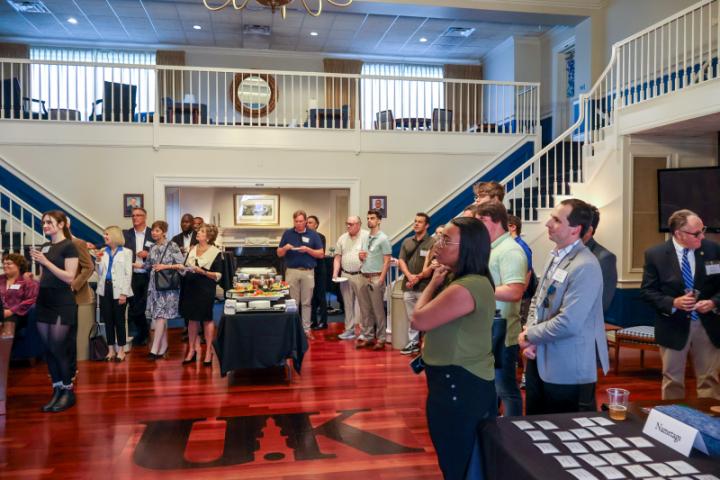 Crowd of alumni listening to speaker present