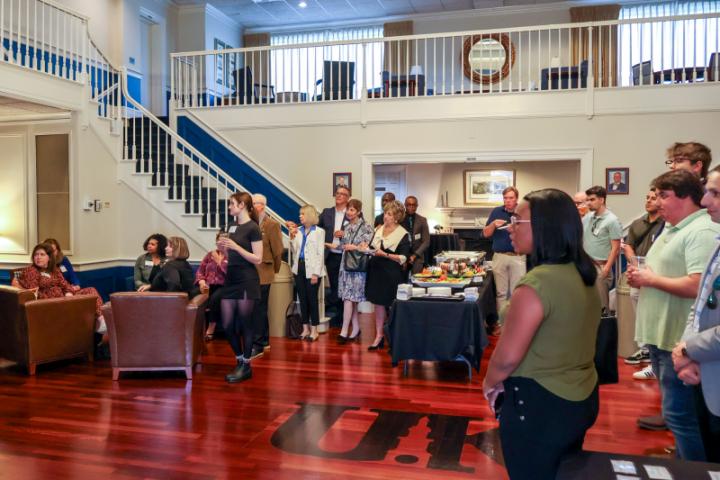 Crowd of alumni listening to speaker present