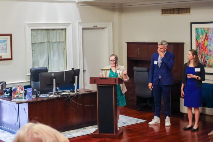 A speaker at a podium